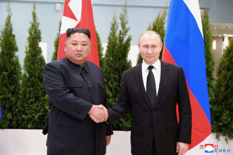 North Korean leader Kim Jong Un shakes hands with Russian President Vladimir Putin in Vladivostok